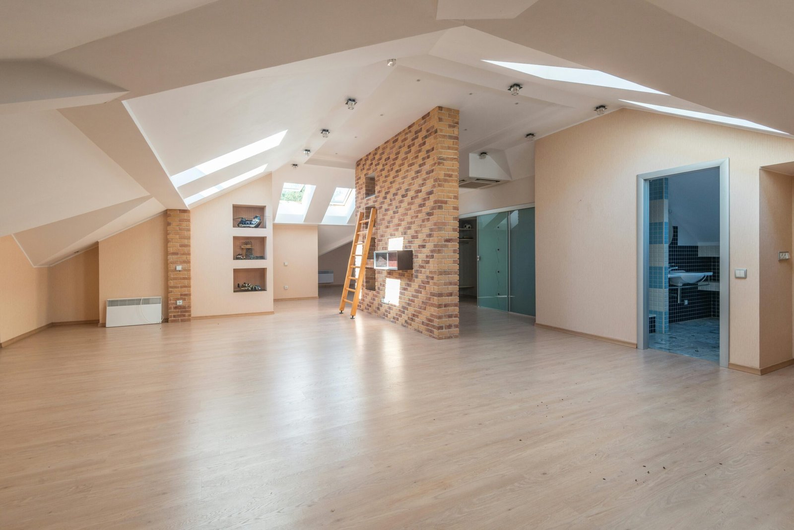 Explore this bright, spacious modern attic apartment with skylights and contemporary design.